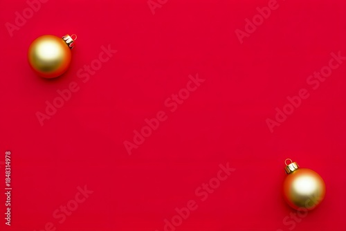 Two golden ornaments on red background