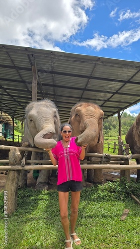young woman with elephants