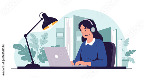 A female call center operator with a headset works on her laptop at a desk with a lamp, providing customer service and support.