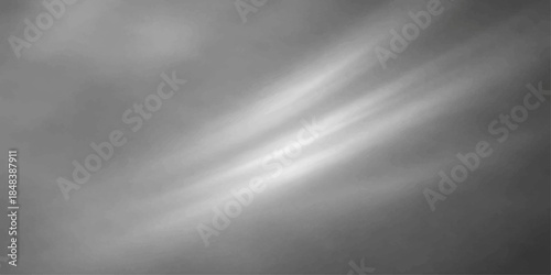 Shiny brushed metal plate texture with a dark silver stainless steel surface features smooth grey aluminum patterns reflecting light like smoke and fog against a metallic backdrop of dark clouds