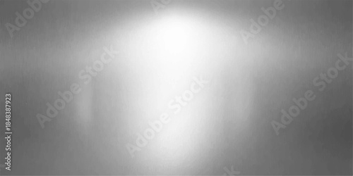 Shiny brushed metal plate texture featuring a polished silver stainless steel surface with a light metallic gray pattern and industrial chrome reflection for a sleek grey aluminum backdrop design