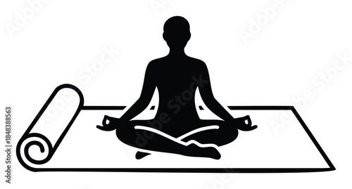 A simple black silhouette of a person meditating in a lotus yoga pose on a mat, perfect for a logo or icon related to wellness, fitness, and spiritual relaxation.