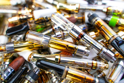 Vape cartridge waste background. Environmental pollution concept. 