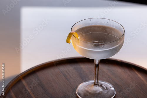 Beautiful Vesper martini garnished with a lemon twist with dramatic lighting