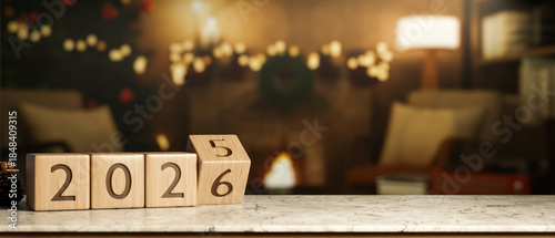 2026 new year countdown wooden block calendar on marble table across fireplace with Christmas decors