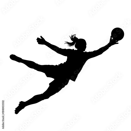 Female soccer goalkeeper diving for the ball, dynamic silhouette in action