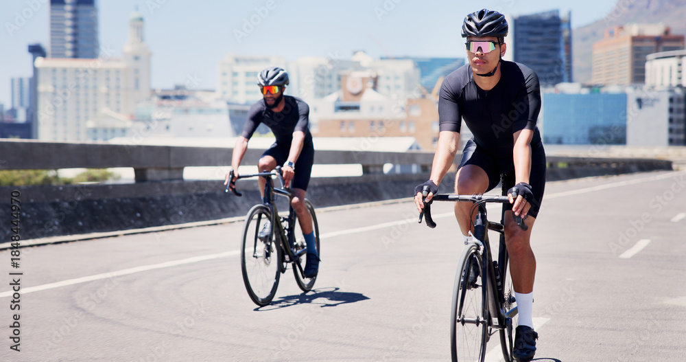 Fototapeta premium Athlete, men and cycling on bike in city for marathon practice, competition workout or fitness. Active, people and bicycle in road for cardio exercise, endurance challenge and pace training for sport