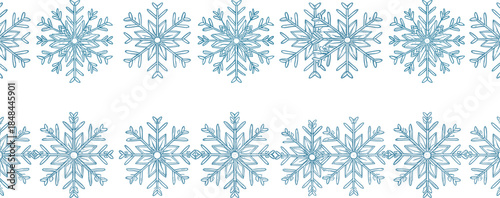 Two horizontal blue snowflake borders with detailed icy crystalline designs for winter holiday cards seasonal invitations and festive Christmas graphic design elements