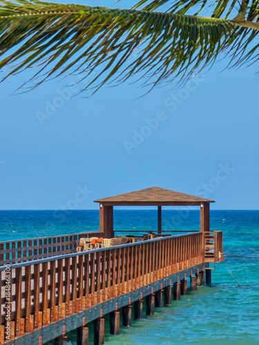 A pier stretching far out to sea.