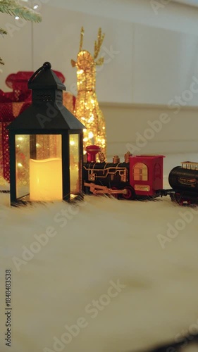 Toy Train Moving in Front of Christmas Tree