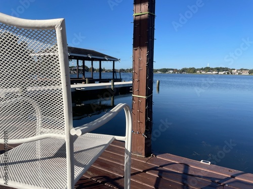 Lake Roy clear blue sky relaxing scene brown deck white chair