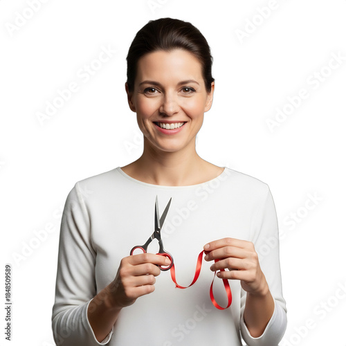 Smiling 30s Caucasian woman holding crafting scissors & red ribbon, ideal for DIY blogs, craft tutorials, holiday projects (Valentine's, Christmas), gift wrapping.
