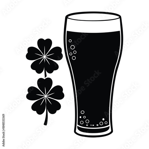 Black silhouette of a pint glass filled with dark beer and two four-leaf clovers