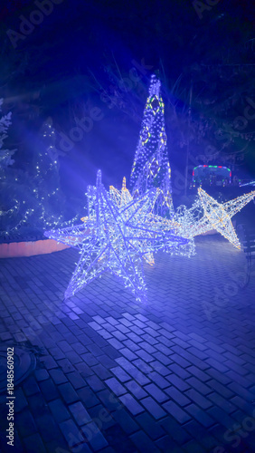 Bright neon signs and garlands Ice skating rink and winter entertainment concept