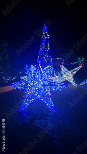 Bright neon signs and garlands Ice skating rink and winter entertainment concept