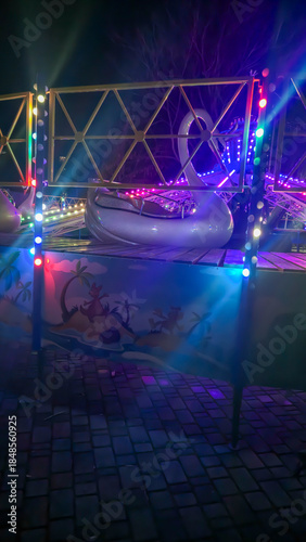 Bright neon signs and garlands Ice skating rink and winter entertainment concept