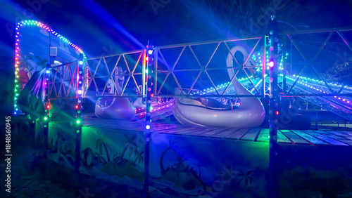 Bright neon signs and garlands Ice skating rink and winter entertainment concept