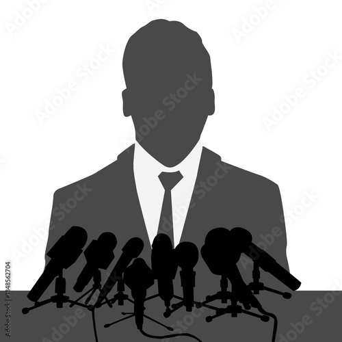 Speaker giving an interview at a press conference with many microphones.eps