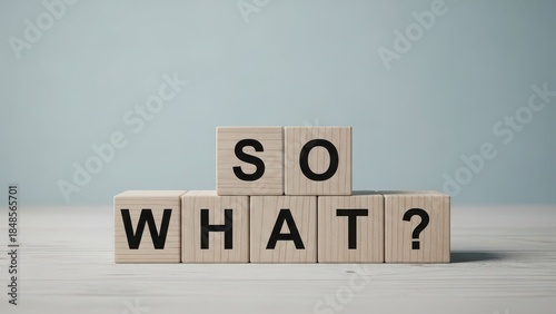 Wallpaper Mural Wooden blocks spelling the phrase so what? representing indifference or questioning significance Torontodigital.ca