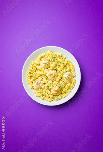 Pasta with chicken meatballs in a creamy sauce. Italian cuisine. Recipe.