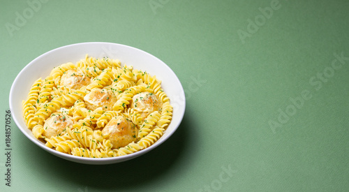 Pasta with chicken meatballs in a creamy sauce. Italian cuisine. Recipe.