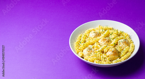 Pasta with chicken meatballs in a creamy sauce. Italian cuisine. Recipe.