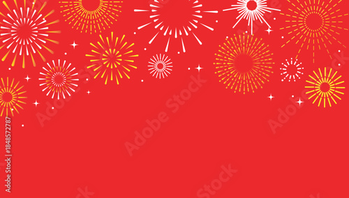 A vibrant display of golden fireworks against a bold red background