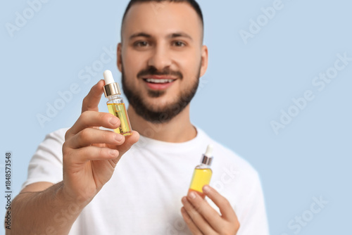 Handsome young man with bot...