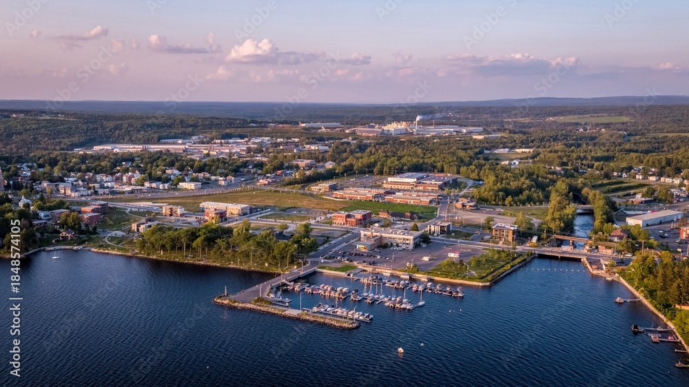 Naklejka premium Aerial View of Lac-Megantic, Quebec, Canada With Boats Docked on the harbor at Sunset