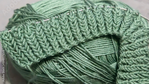 Knitting patterns and details for sweaters, hats, and other crocheted items.