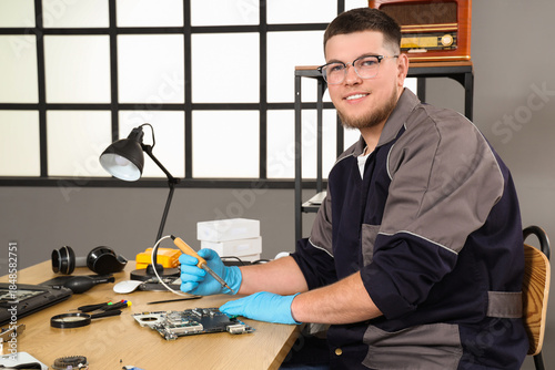 Male technician repairing P...