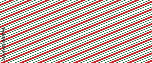 Christmas seamless pattern with a classic candy cane design with alternating red and green diagonal stripes on a white background, perfect for festive holiday themes.