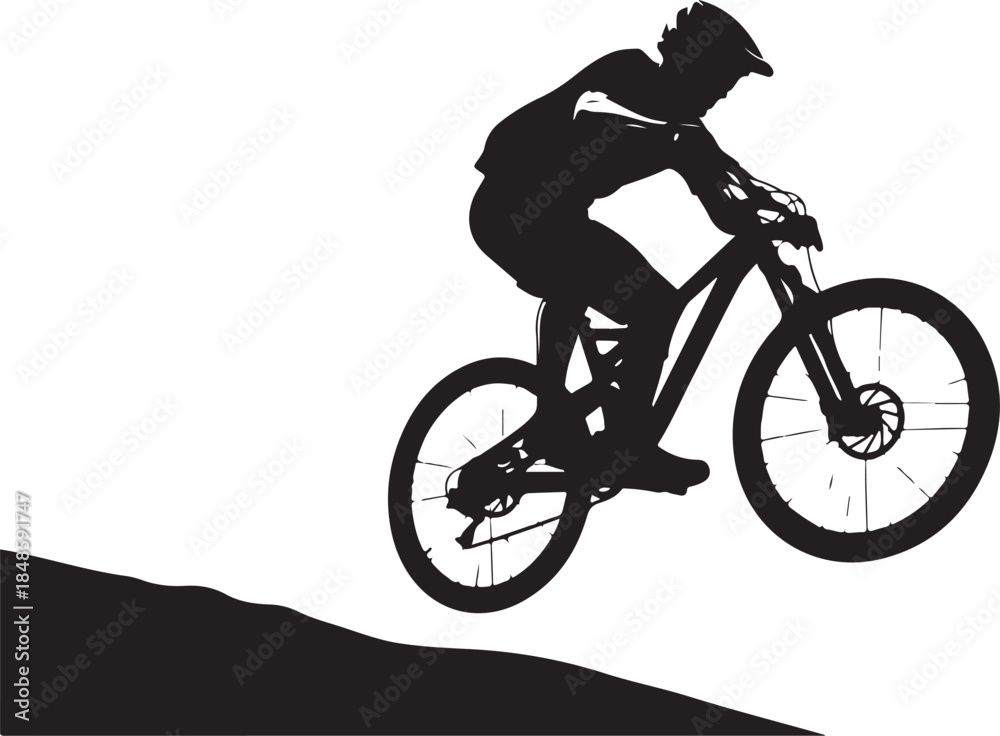 Fototapeta premium Silhouette of Mountain Biker in Action Descending Hill