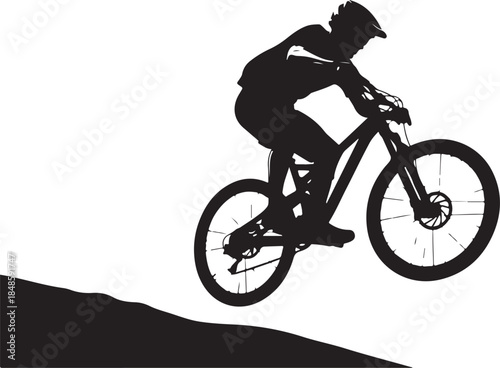 Silhouette of Mountain Biker in Action Descending Hill