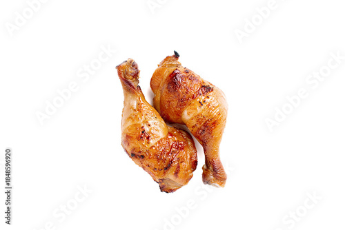 Grilled chicken legs on white background.