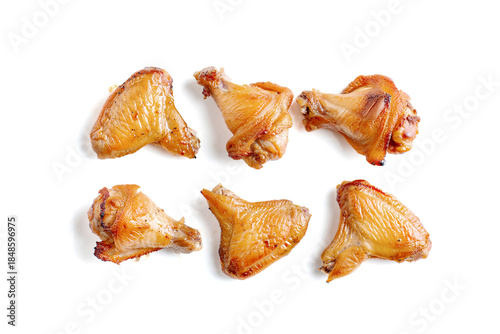 Grilled chicken wings on a white background.