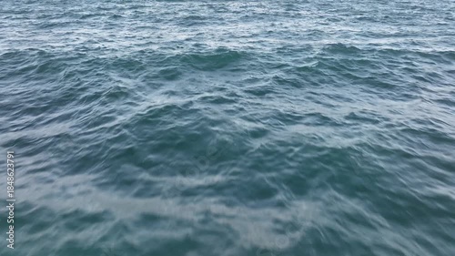 Drone video flight over ocean, sea. Close to the water