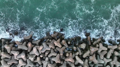 Top down view of coast line, concrete tetrapods.