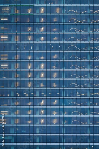 Wallpaper Mural Modern business glass facade building with illuminated office windows Torontodigital.ca