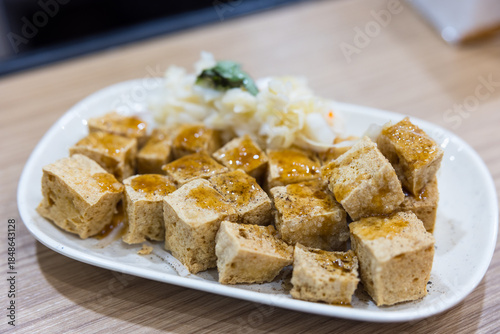 Schilderij op canvas Traditional Taiwanese stinky tofu served on plate