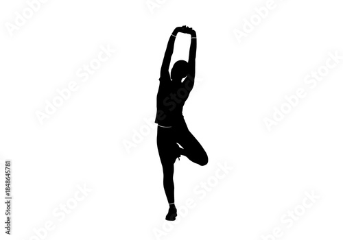 Silhouette of Woman in Tree Pose Stretching Arms Overhead.