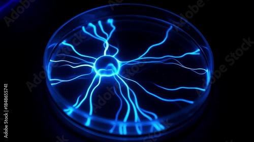 Glowing Blue Chemical Spreading In Petri Dish Like Neural Pathways