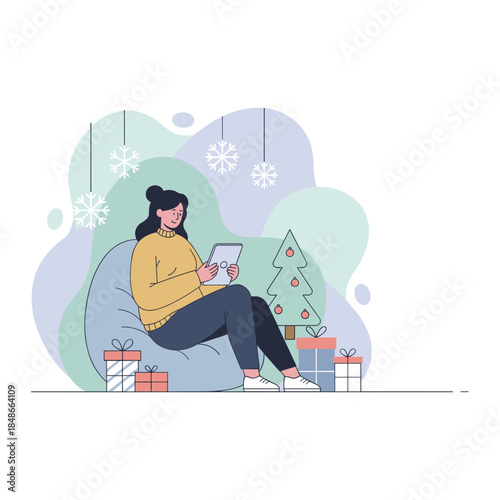 Young woman uses a digital tablet while relaxing on a beanbag chair near Christmas gifts and a tree Holiday shopping concept