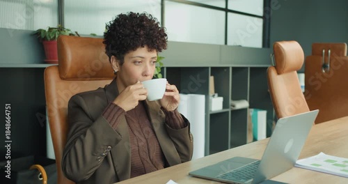 Business professional contemplating strategies while sipping coffee calmly