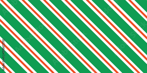 Christmas seamless pattern. Red and green diagonal stripes background. Candy cane repeating decoration wallpaper. Winter holiday lines backdrop. vector