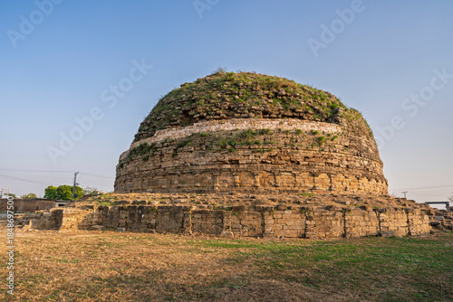 Late afternoon landscape view of ancient buddhist landmark Mankiala stupa aka Manikyala stupa, Tope Mankiala, Punjab, Pakistan