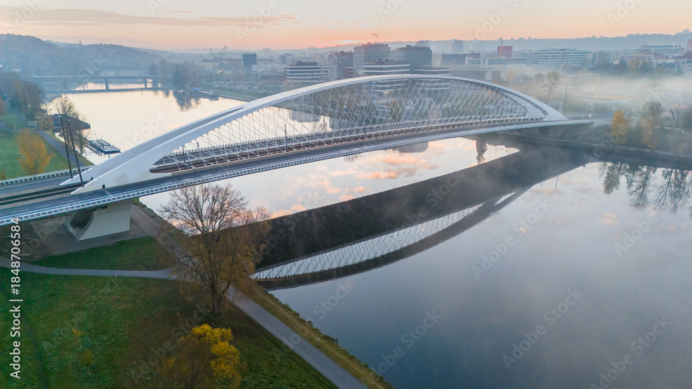 Obraz premium Troja Bridge in Prague. The new and modern Troja Bridge over the Vltava River in Holešovice, Prague, Czech Republic. A bridge for cars and trams in the center of historic Prague.