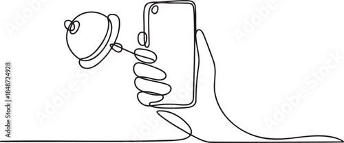 Hand holding smartphone and headphones