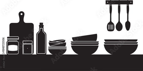 Kitchen utensils and dishes on countertop in black silhouette