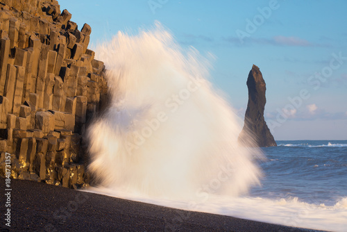Photos Traveler on a huge rock in the sea